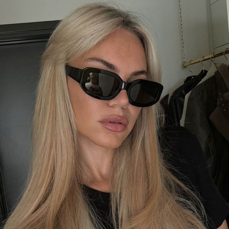 blonde model wearing the Indi in Black / smoke sunglasses from Vehla eyewear