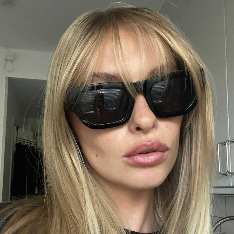 model wearing the finn sunglasses from vehla eyewear in black / smoke