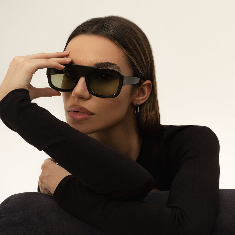 model wearing the kaia sunglasses from vehla eyewear in malbec / khaki