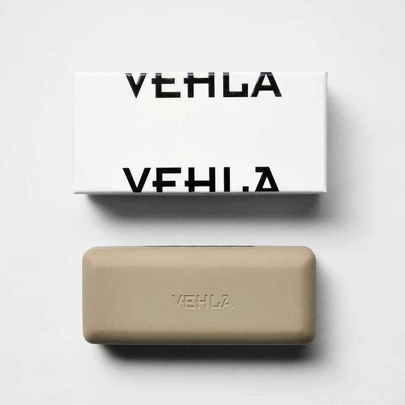 vehla eyewear packaging of the white rectangle box with black split logo and grey hard case with logo
