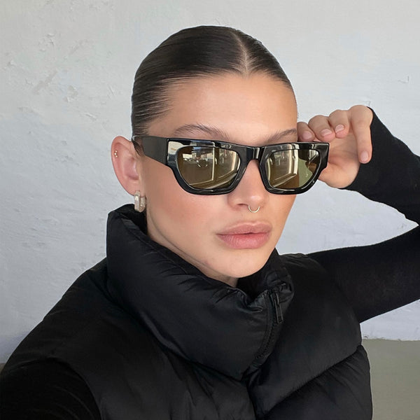 model wearing the finn sunglasses from vehla eyewear in black / khaki