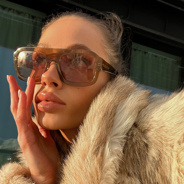 model wearing the kaia sunglasses from vehla eyewear in caramel / toffee