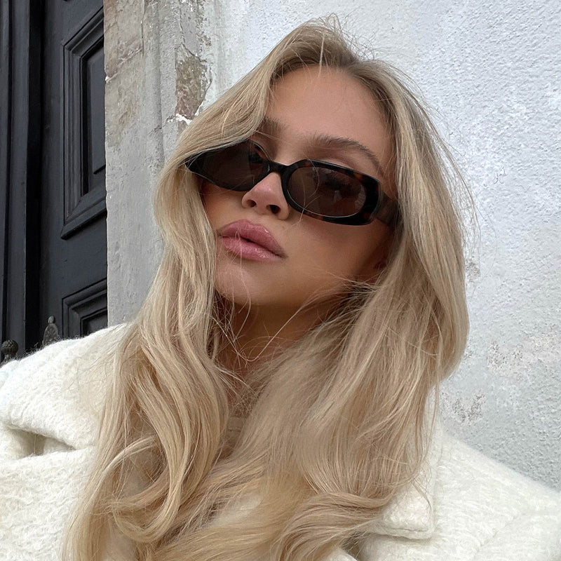 blonde model outside wearing the olsen choc tort choc sunglasses from Vehla eyewear