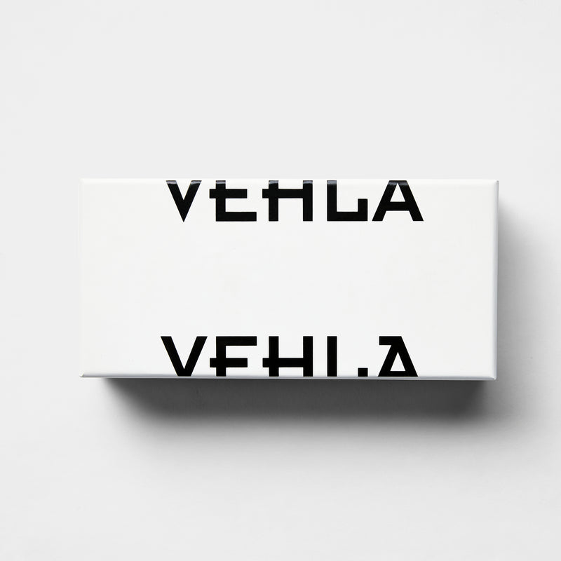 white rectangle sunglasses box with a split black vehla logo