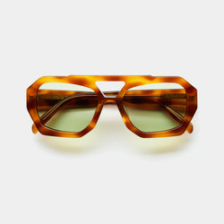 front image showing the arm of vehla eyewear river sunglasses in honey tort / sage